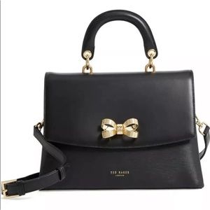 Ted Baker London Lauree Looped Bow Satchel Black. Gold accents Removable strap.